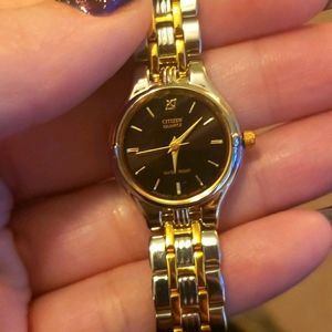 Women's stainless steel and gold citizens watch